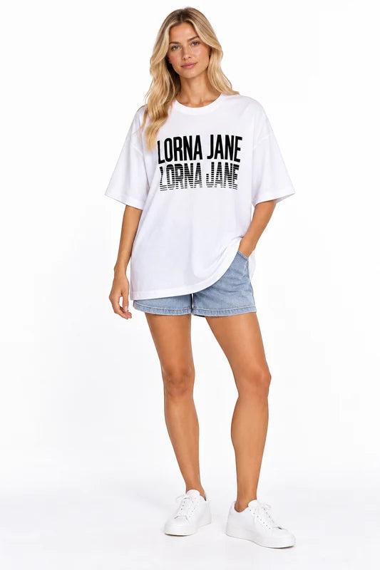 Lorna Jane White LJ Retro Oversized Tee – Size S shown on a model.
