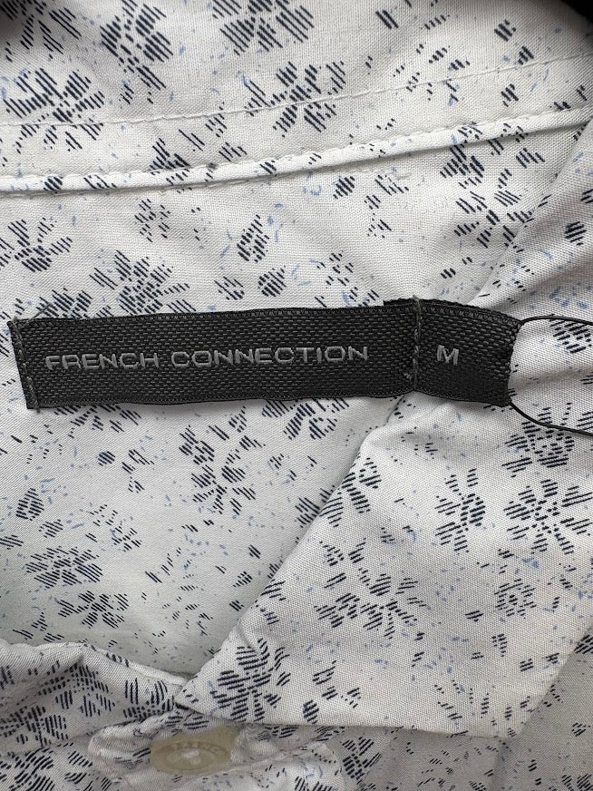 Brand and size label — French Connection White Floral Cut Long Sleeve Shirt – M.