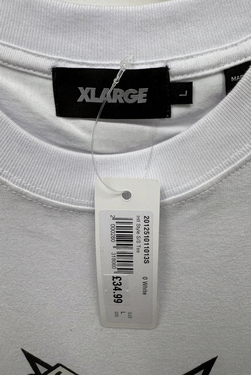 Brand and size label — XLARGE White Graphic T-Shirt - L.