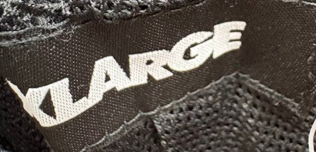 Brand and size label — XLARGE Black/Grey Check Truck Pants – M.