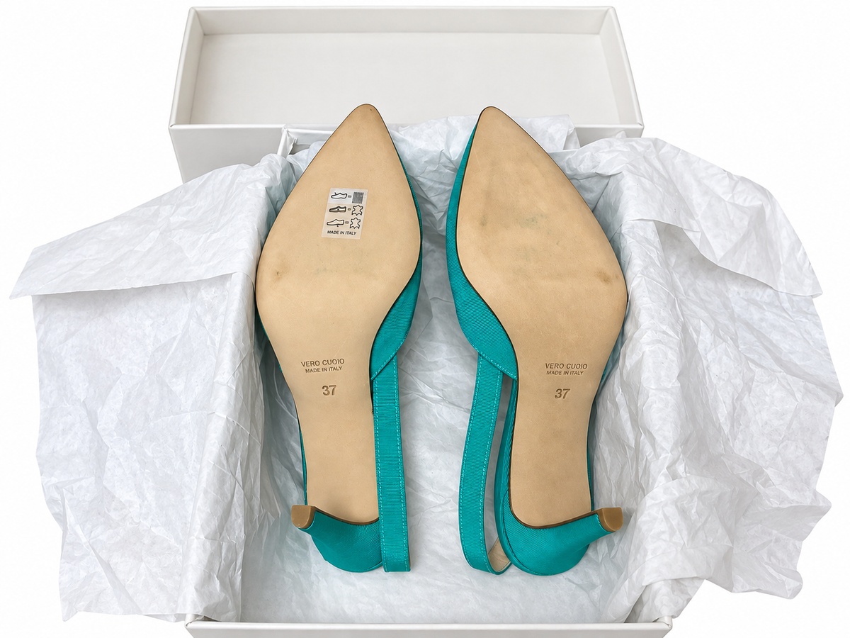Acquamarina EU 37 soles with light storage marks and attached material label; background removed