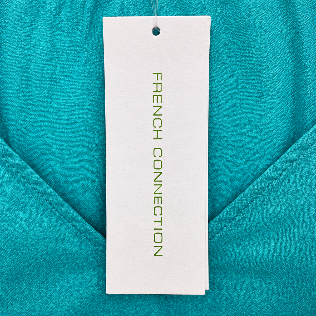 Retail tag showing product reference — French Connection Turquoise V-Neck Puff Sleeve Top – M.