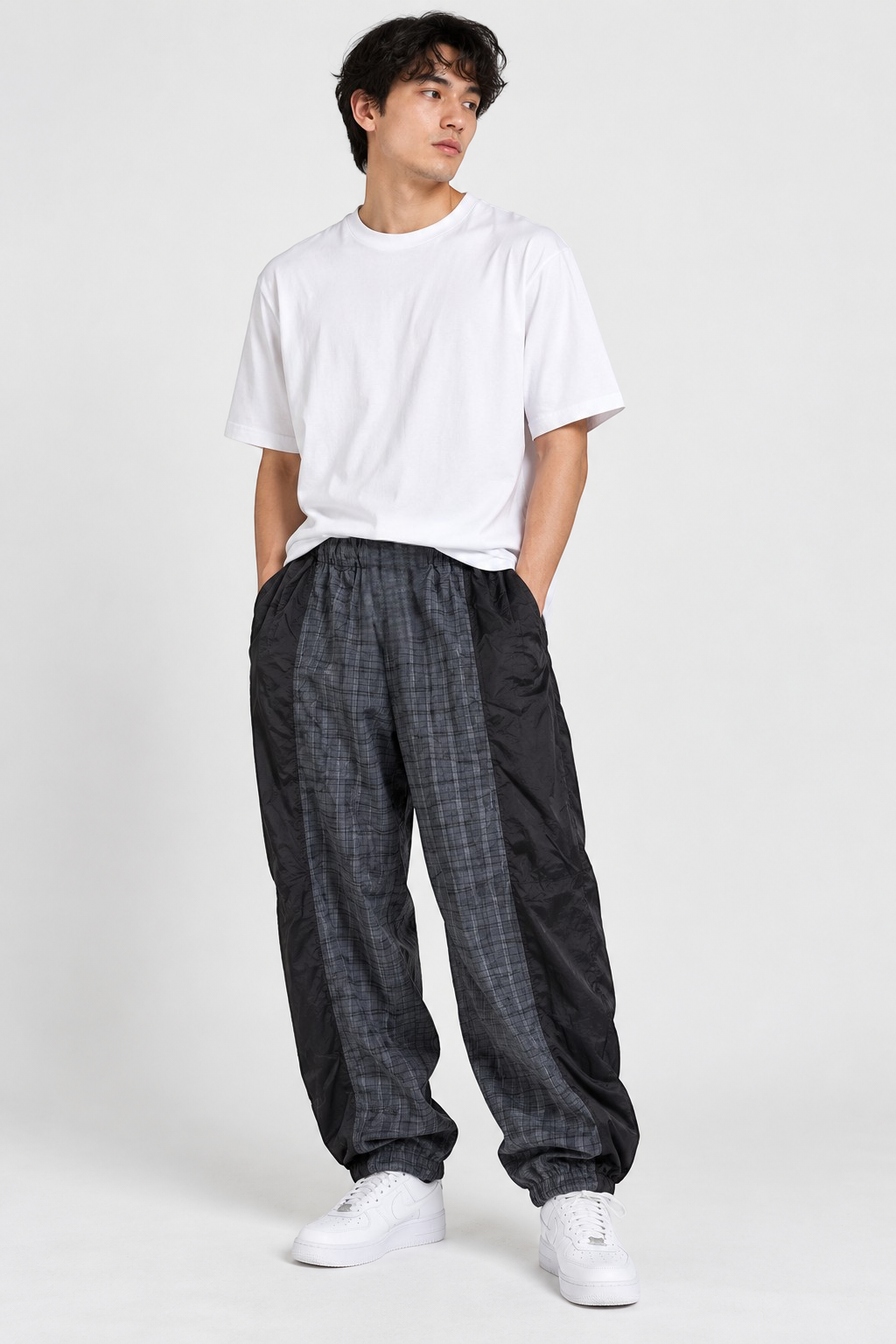 XLARGE Black/Grey Check Truck Pants – M shown on a model.
