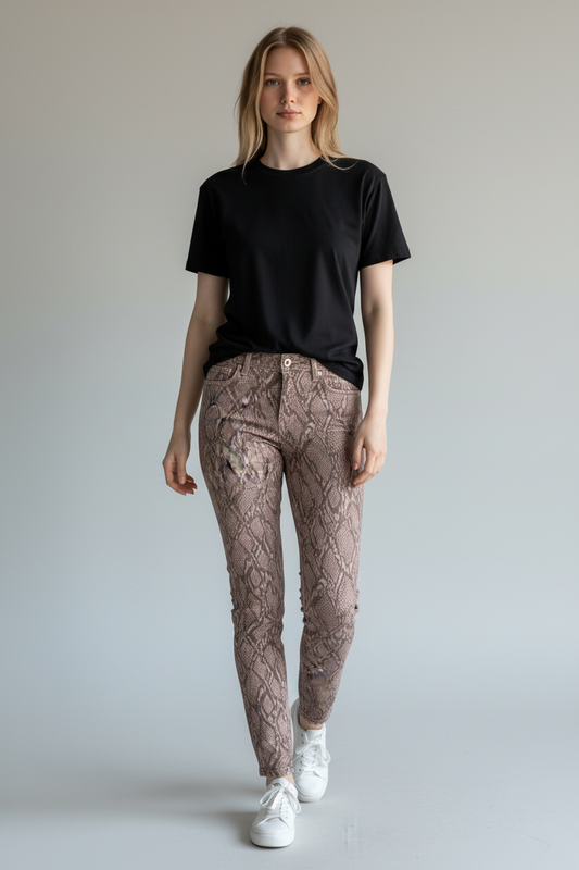 Female model wearing J Brand Alana dusty pink snake-print cropped skinny jeans, front view